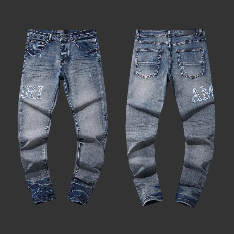 Amiri Staggered Logo Skinny Jeans (Blue)